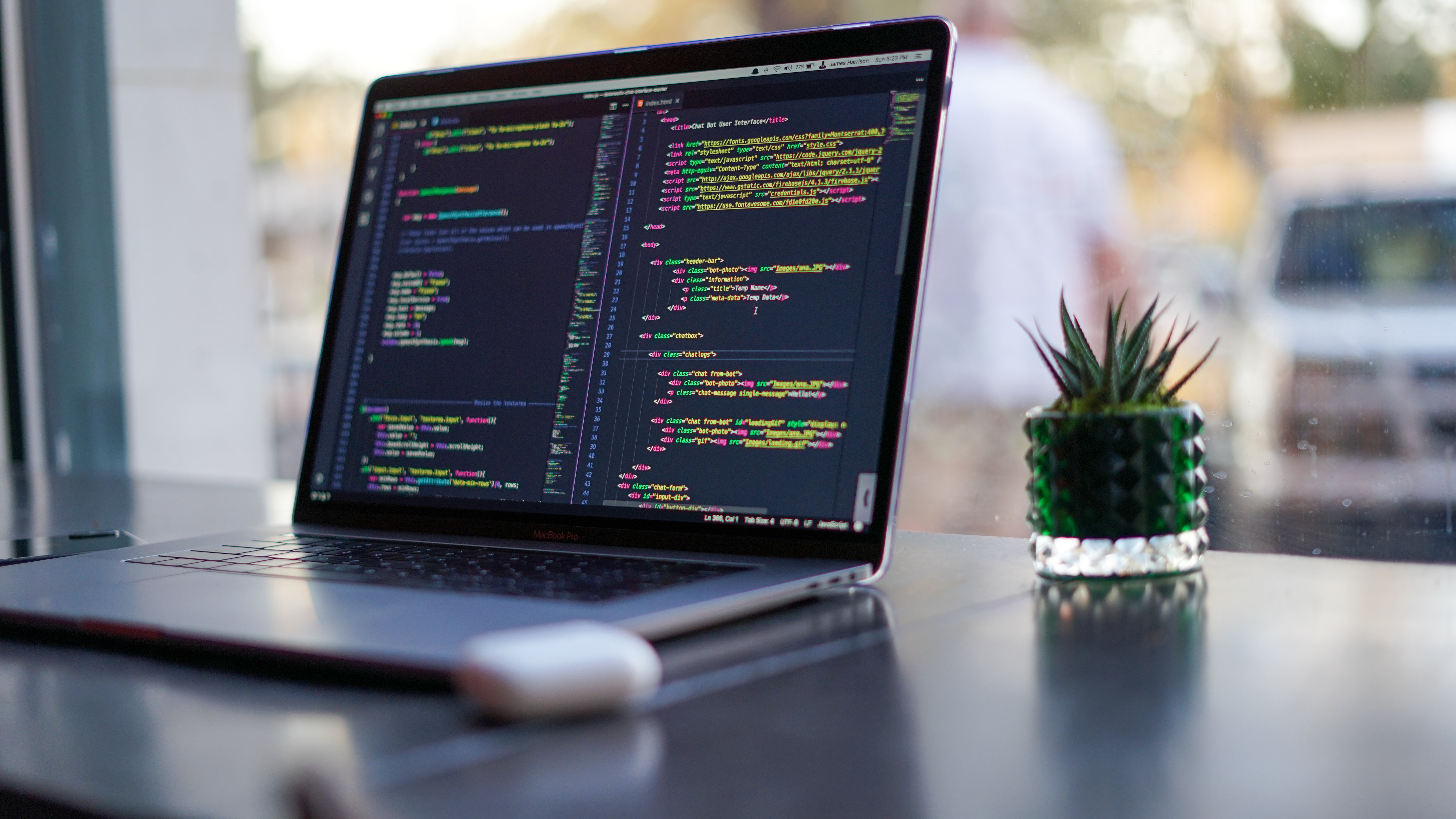 Image of a laptop in front of a window